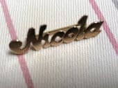 Nicola Name Brooch Circa 1970s 9ct yellow gold