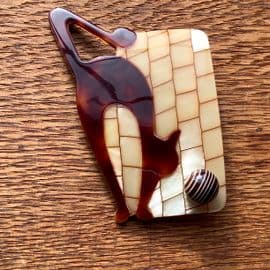 SOLD A Lea Stein Art Deco Style Cat and Ball Brooch by Lea Stein