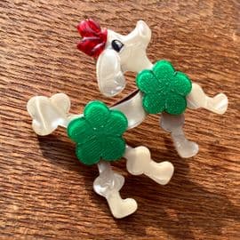 SOLD A Lea Stein Cream Poodle with Green Pom Pom Hairdo and Red Bow