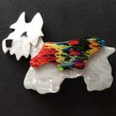 SOLD A Lea Stein Terrier Dog Brooch - White Dog, Multi Coloured Jacket