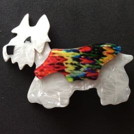 SOLD A Lea Stein Terrier Dog Brooch - White Dog, Multi Coloured Jacket