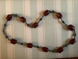 SOLD Bead Necklace - Cherry Amber coloured Bakelite Barrels with Hematite and Metal Disc Rings