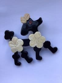 SOLD Lea Stein Black Poodle Brooch with Cream Pom Pom Hairdo and Sparkly Gold Bow