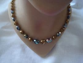 Vintage faceted glass beads in bronze and irridescent black (SOLD)