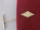 Vintage tie tack with carved mother of pearl decoration circa 1960s (SOLD)