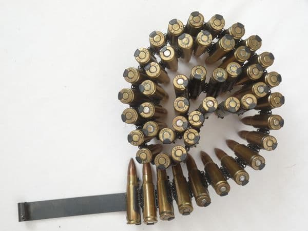 50 linked inert 7.62 x 39mm RPD machine gun cartridges with starter tab.