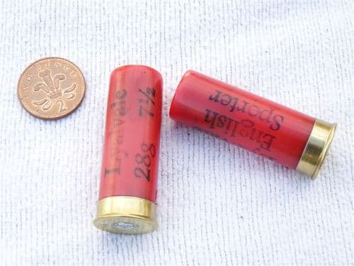 Inert 12 bore cartridge with plastic case in bright red