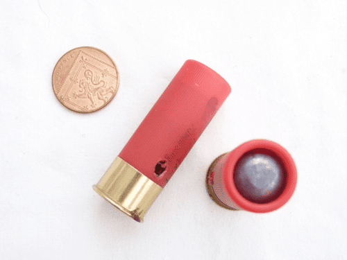 Inert 12 bore cartridge with plastic case in bright red, single lead slug