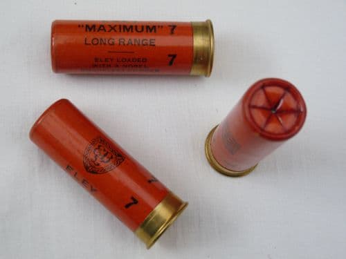 Inert 12 bore shotgun cartridge with waxed paper casing in orange, crimped end