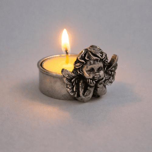 Bougie ange pensif en étain