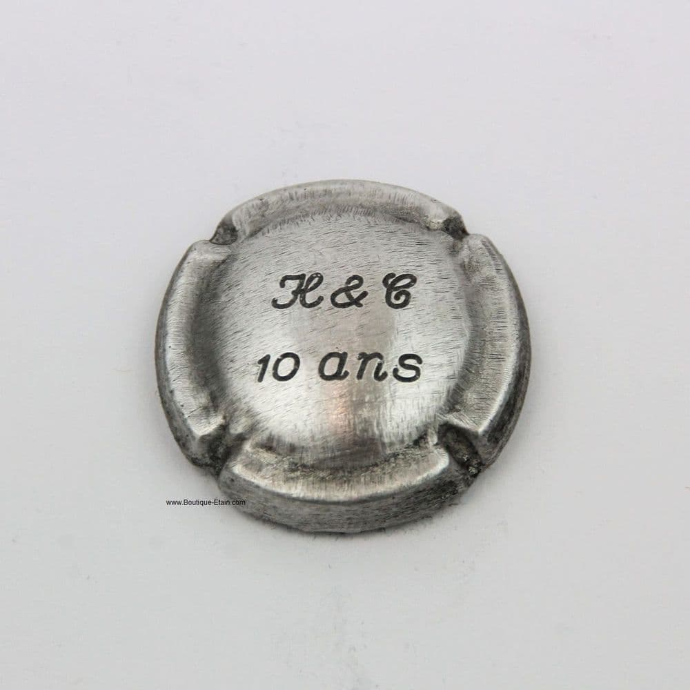 Capsule de champagne en étain , gravée