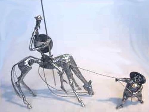 Dom Quichotte en pleine lecture et Sancho qui tire