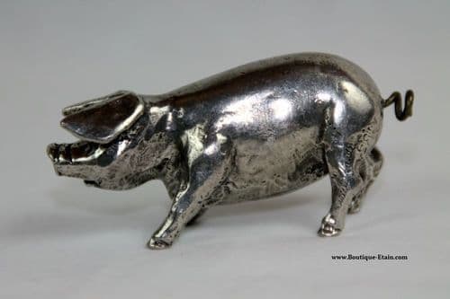 Le gros cochon queue en tire bouchon en étain