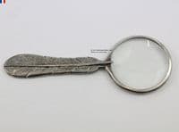 Loupe à main motif plume en étain