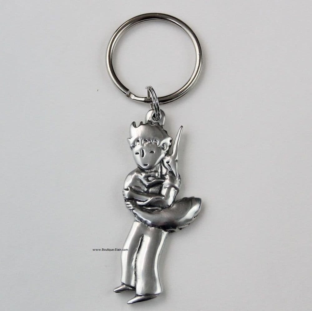 Porte-clés ou porte-clefs Le petit Prince et le renard dans ses bras en étain.