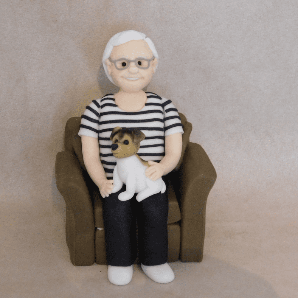 Person & dog in Armchair Cake Topper