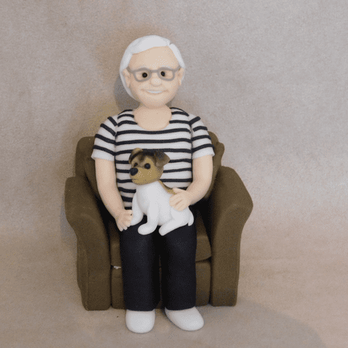Person & dog in Armchair Cake Topper