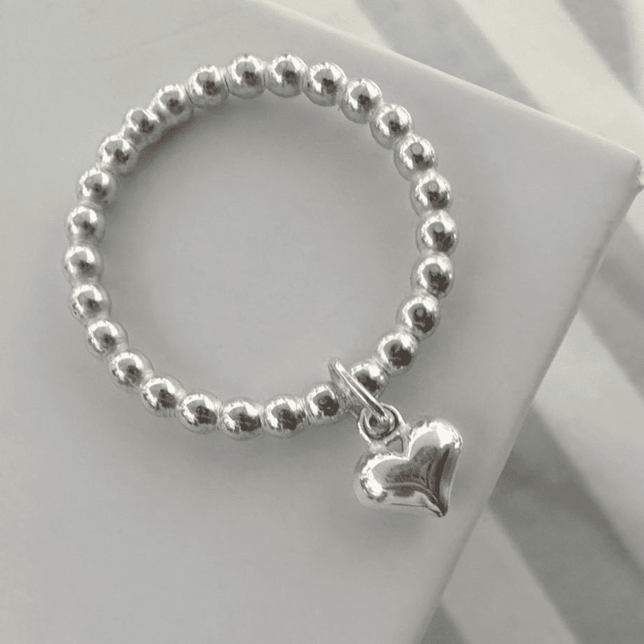 Silver ring sales with dangling heart