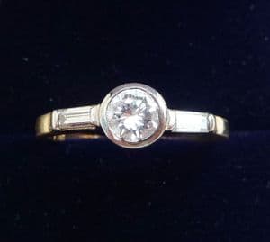 Beautiful 18ct and white gold 0.65ct Diamond solitaire and baguette cut engagement vintage ring
