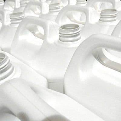 Close up of lots of white plastic Jerry cans