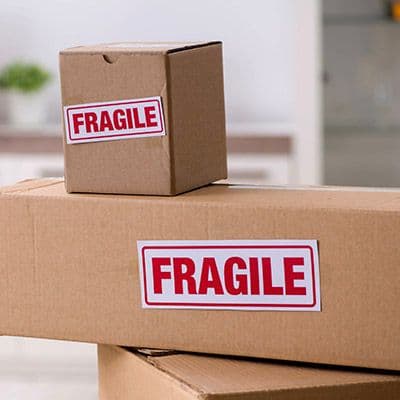 Fragile labels stuck on different sized boxes