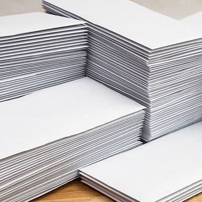 Different stacks of white envelopes