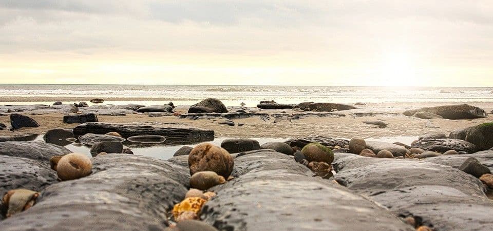 Coastal Jewellery Department - image of sunlight across a beach