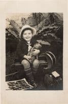 Child Laughing at Military Picture Toy Hat Old Drum Transport Truck Kodak Postcard