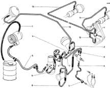 Rubber LHM suction hose between top of reservoir and HP pump