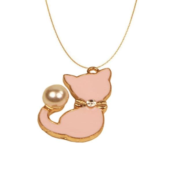 A beautiful butterfly pendant made of mother of pearl and emblazoned with small glittering crystals on a gold metal base. J020010