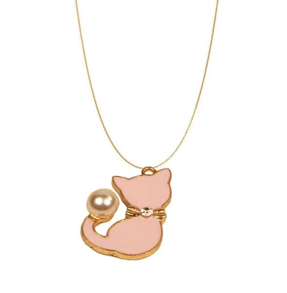 A beautiful butterfly pendant made of mother of pearl and emblazoned with small glittering crystals on a gold metal base. J020010