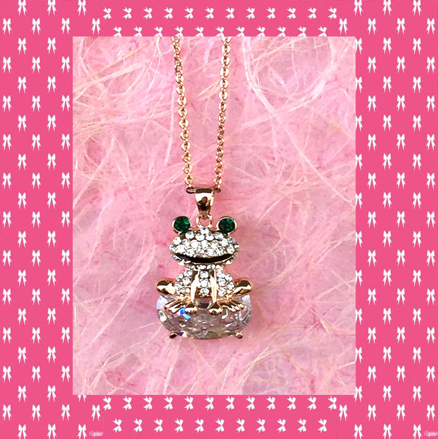 A beautiful butterfly pendant made of mother of pearl and emblazoned with small glittering crystals on a gold metal base. J020010