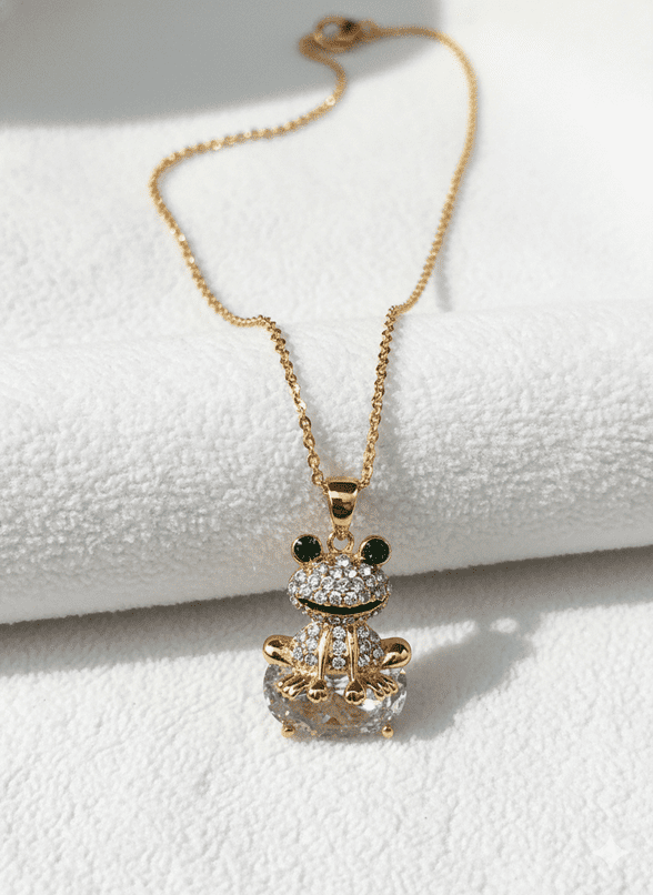 A beautiful butterfly pendant made of mother of pearl and emblazoned with small glittering crystals on a gold metal base. J020010