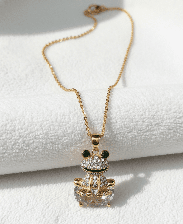 A beautiful butterfly pendant made of mother of pearl and emblazoned with small glittering crystals on a gold metal base. J020010