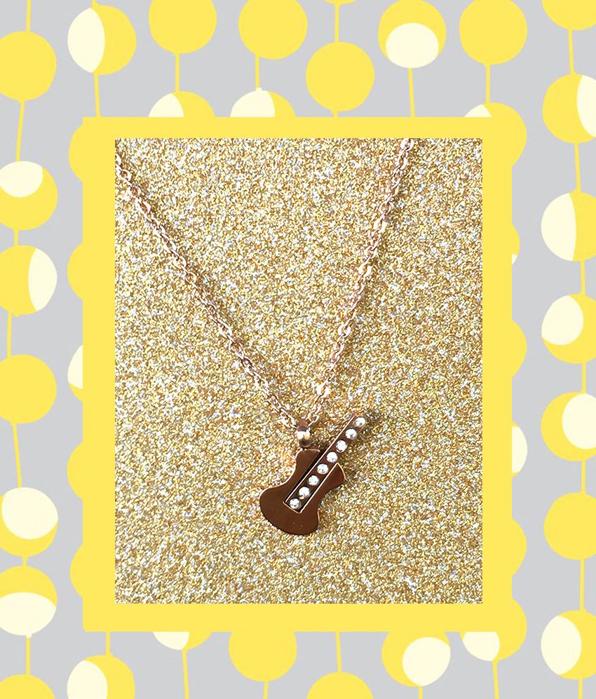 A beautiful butterfly pendant made of mother of pearl and emblazoned with small glittering crystals on a gold metal base. J020010