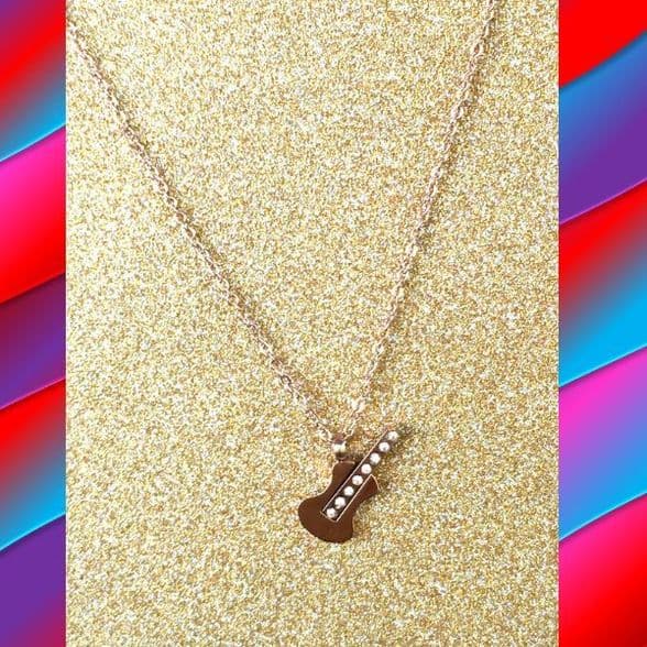 A beautiful butterfly pendant made of mother of pearl and emblazoned with small glittering crystals on a gold metal base. J020010