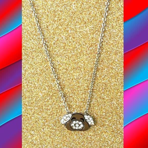 A beautiful butterfly pendant made of mother of pearl and emblazoned with small glittering crystals on a gold metal base. J020010