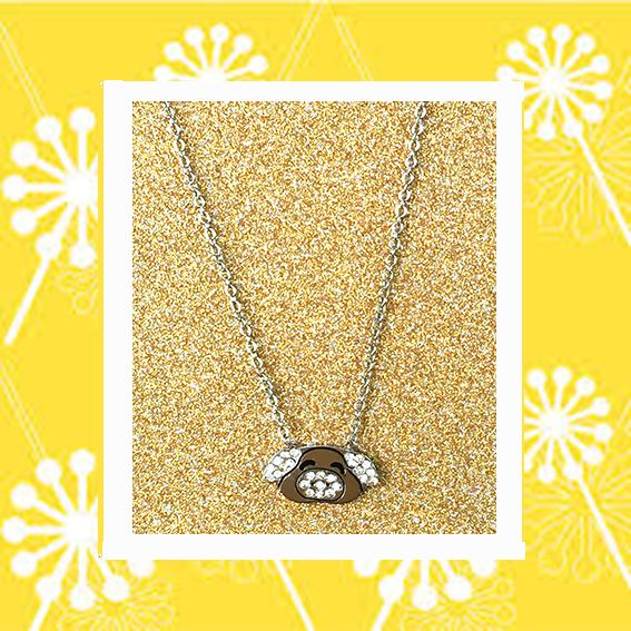 A beautiful butterfly pendant made of mother of pearl and emblazoned with small glittering crystals on a gold metal base. J020010