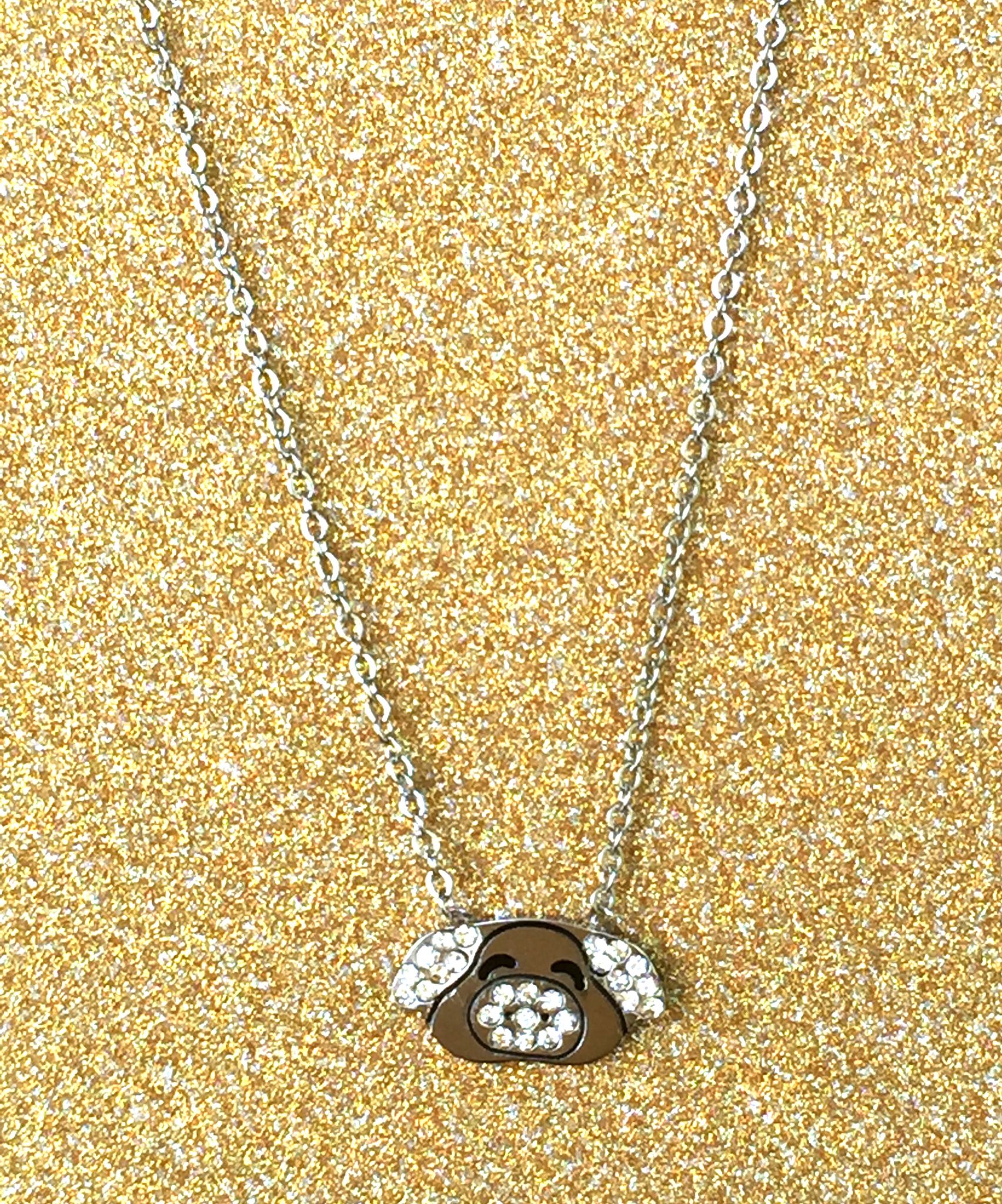 A beautiful butterfly pendant made of mother of pearl and emblazoned with small glittering crystals on a gold metal base. J020010