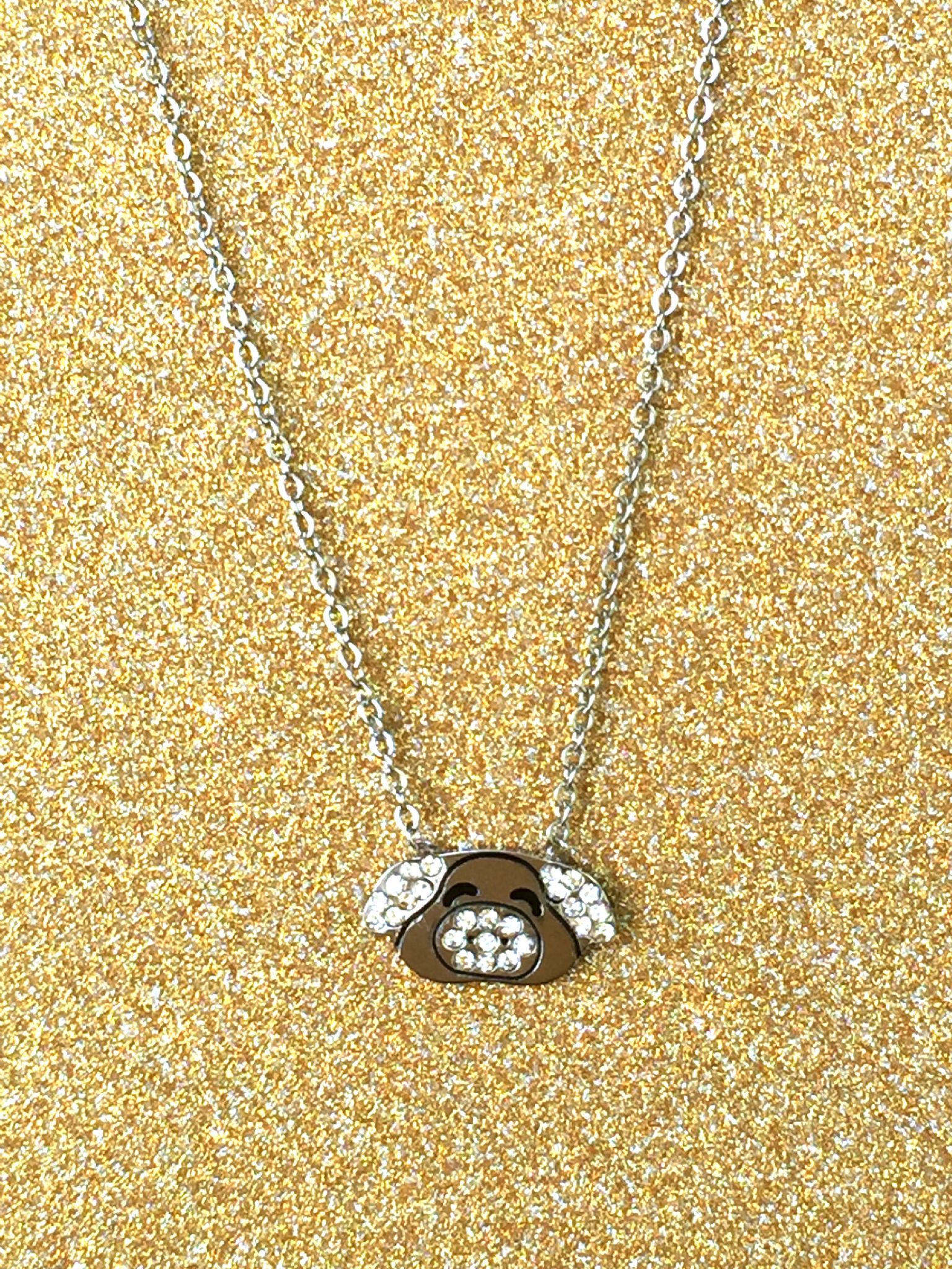 A beautiful butterfly pendant made of mother of pearl and emblazoned with small glittering crystals on a gold metal base. J020010