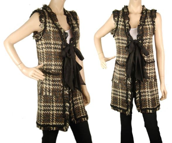 A beautiful butterfly pendant made of mother of pearl and emblazoned with small glittering crystals on a gold metal base. J020010