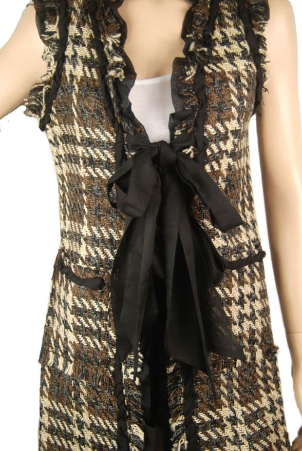 A beautiful butterfly pendant made of mother of pearl and emblazoned with small glittering crystals on a gold metal base. J020010