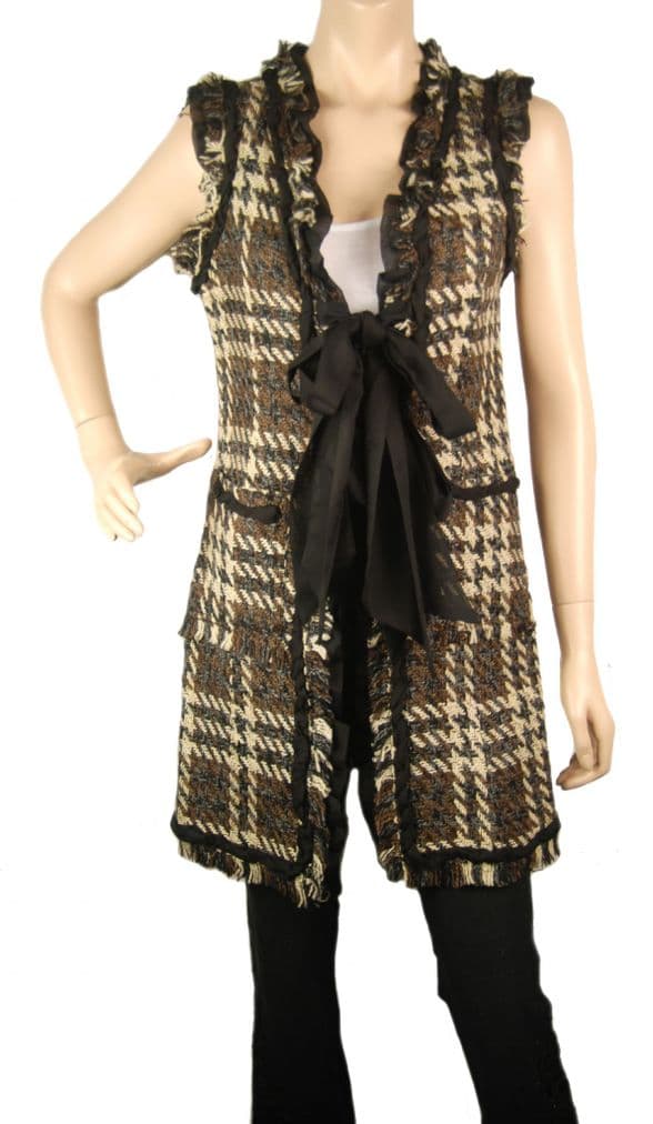 A beautiful butterfly pendant made of mother of pearl and emblazoned with small glittering crystals on a gold metal base. J020010