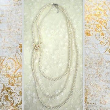 J010078 Three strings of pearls with removable triple bow pearl brouche