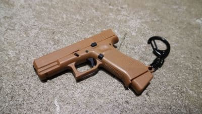 1:3 Miniature 19 tan plastic model keychain