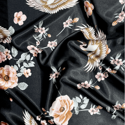 CRANES & FLORAL PINKS ON BLACK: Satin Dressmaking Polyester Fabric