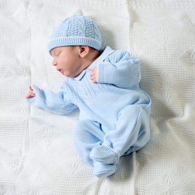 Blue knitted onesie with hat