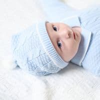 Pink knitted onesie with hat