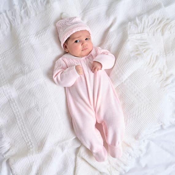 Pink knitted onesie with hat