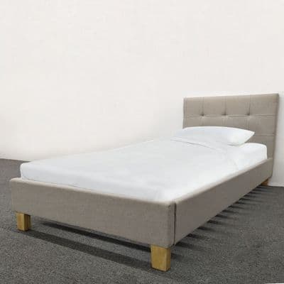 Single bed, Upholstered in Cream fabric- with Wooden feet